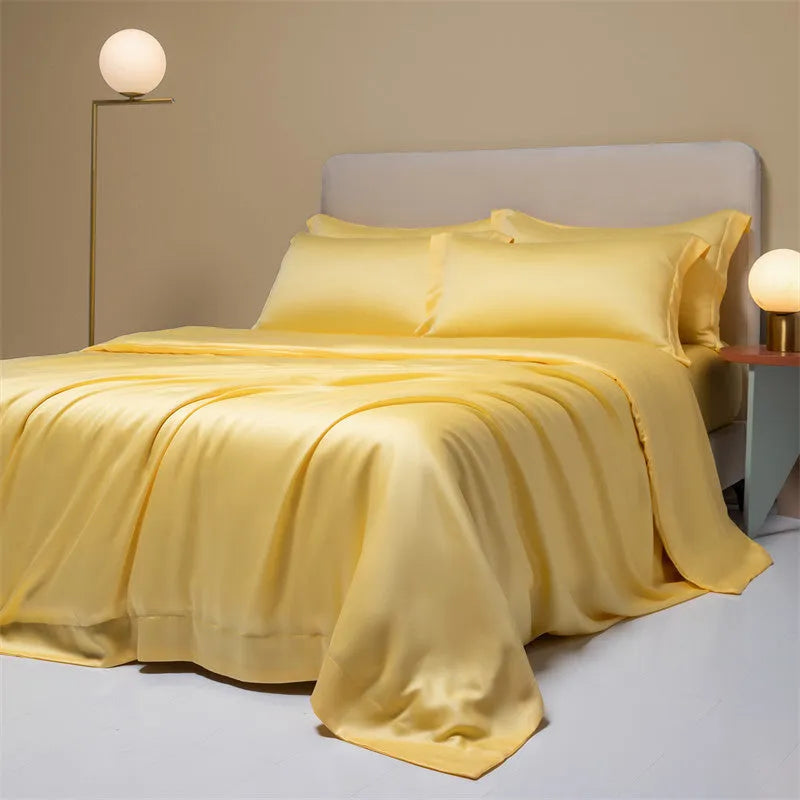 Four-piece Lenzing Tencel quilt sheet set in Antique White showing quilt cover and pillowcases with modern simple style