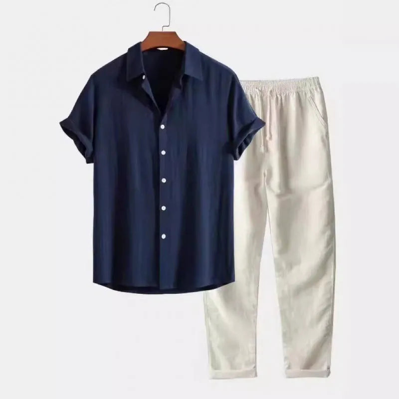 Man wearing a beige loose-fit linen-look short sleeve shirt and matching trousers from a casual suit.
