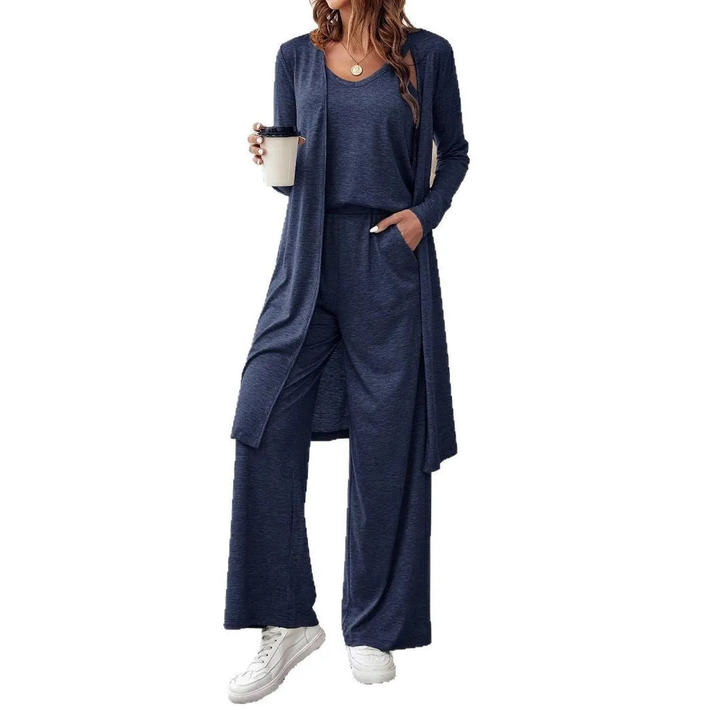 Blue women's three-piece casual suit set with sling top, long cardigan, and trousers on a hanger.