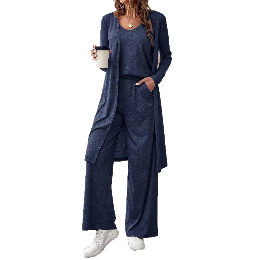 Blue women's three-piece casual suit set with sling top, long cardigan, and trousers on a hanger.