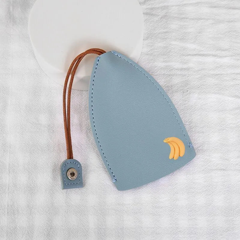 Colourful cartoon pull-out key case made from PU leather, showing the key extended from its protective sleeve.