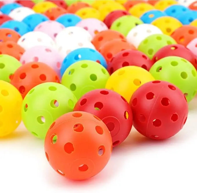 Multi-colour 42mm PE golf practice balls with 26-hole design in net pocket