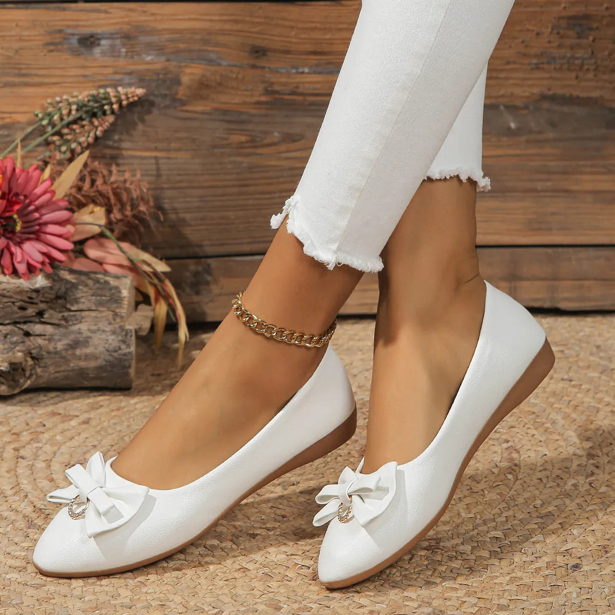 Women's beige casual flat shoes with a bowknot detail, shallow mouth, round toe, and flat rubber sole.