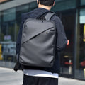 Waterproof PU leather laptop backpack in black, blue, and grey colour options