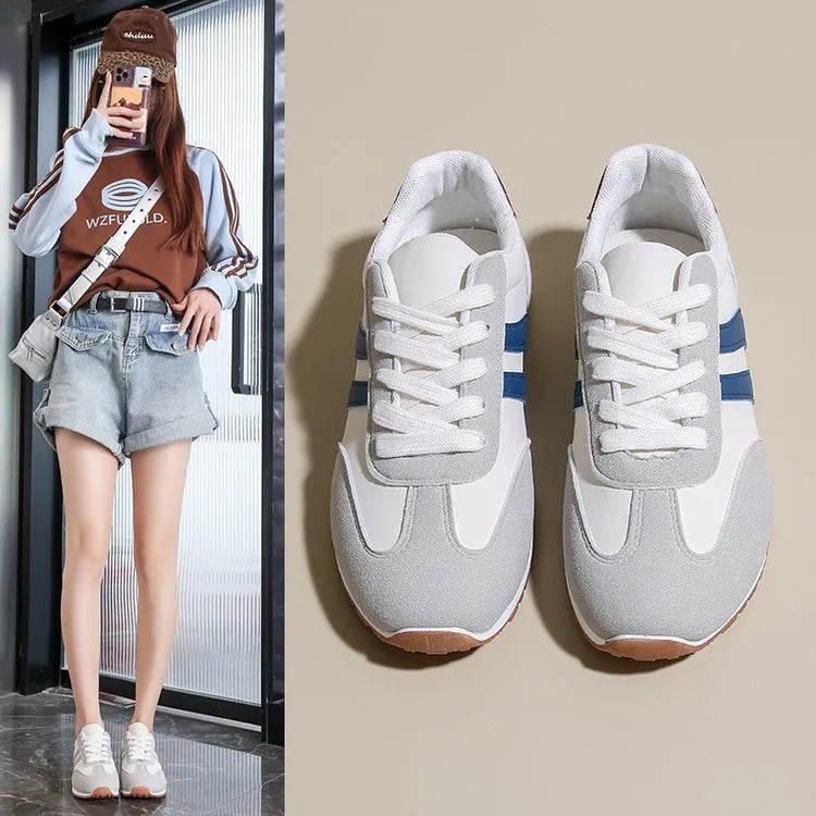 Blue and grey Cortez-style striped casual trainers with round toe and flat rubber sole.
