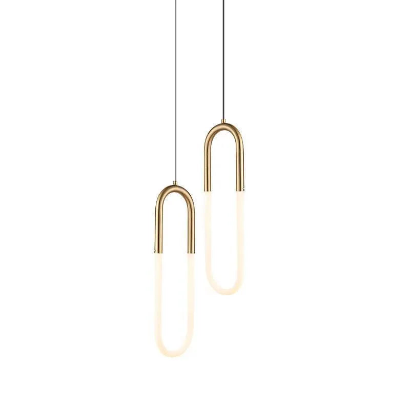 Nordic minimalist U-shaped metal bedside pendant light on a dark background.