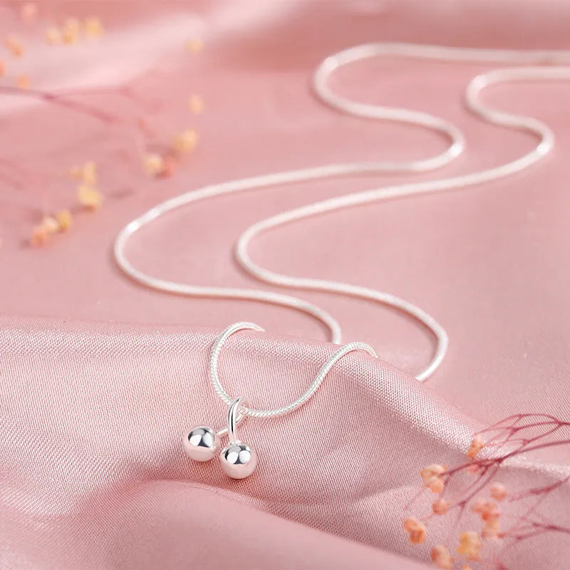 Silver cherry necklace with adjustable snake chain and fruit-shaped pendant