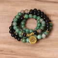 Green and black alloy beaded bracelet with elastic closure showing natural style design