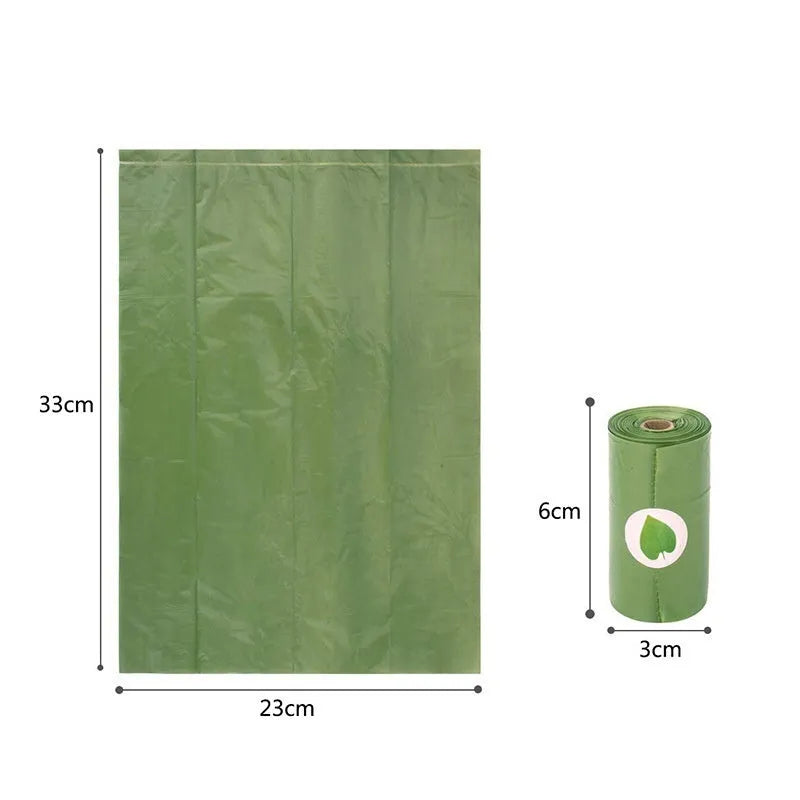 Roll of green EPI degradable dog poop bags next to a white dispenser on a table.