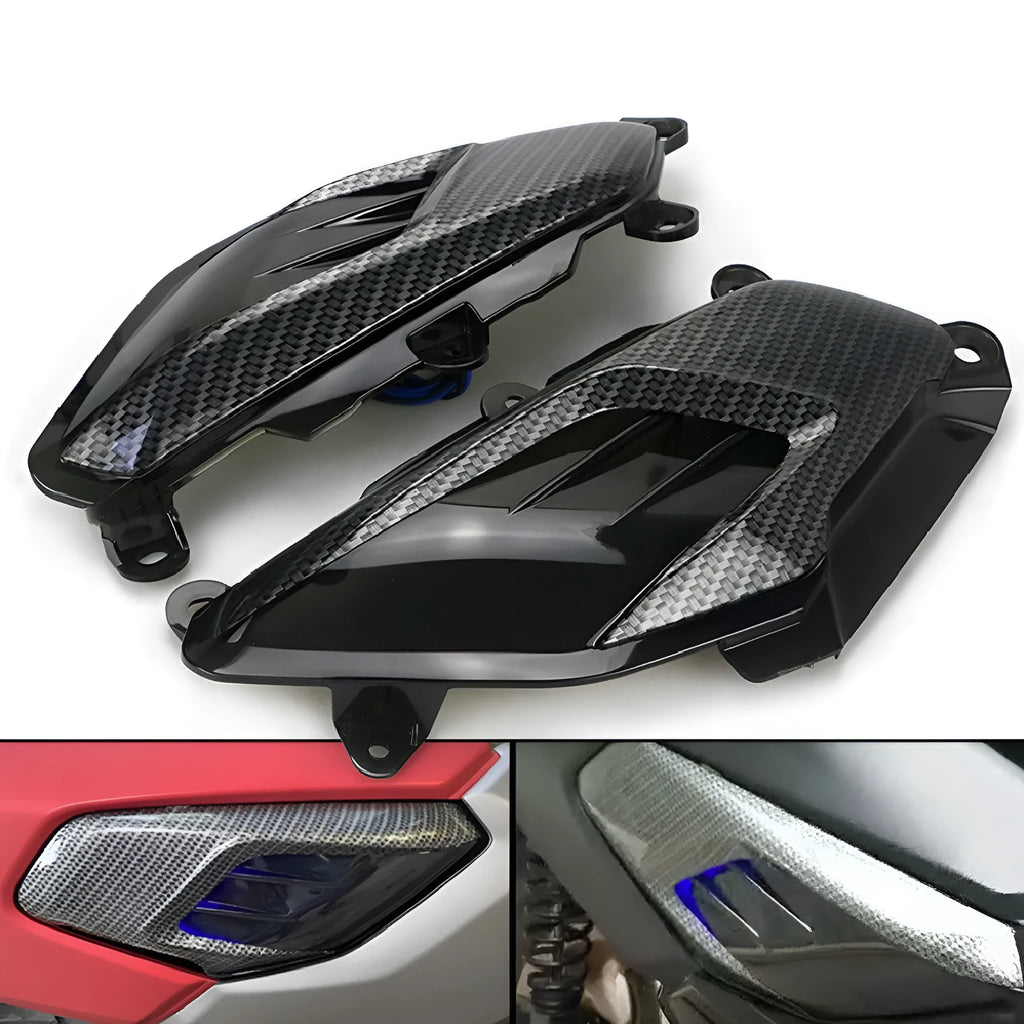 Pair of carbon fibre style LED side lamps for Yamaha NMAX scooter on a white background.