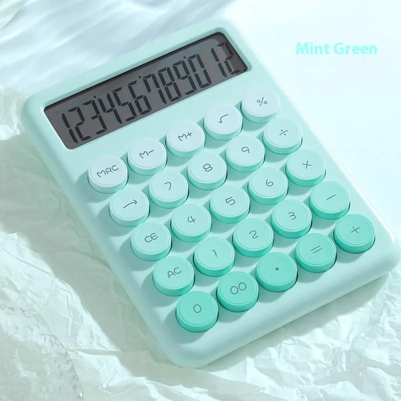 Dopamine gradient colour desk calculator in violet, pink, blue, or mint green on a desk.