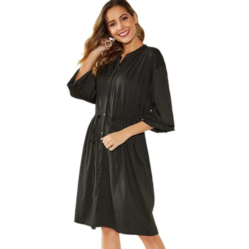 A-line midi dress with elastic waist, long sleeves, and a cinched belt in black and red colour options