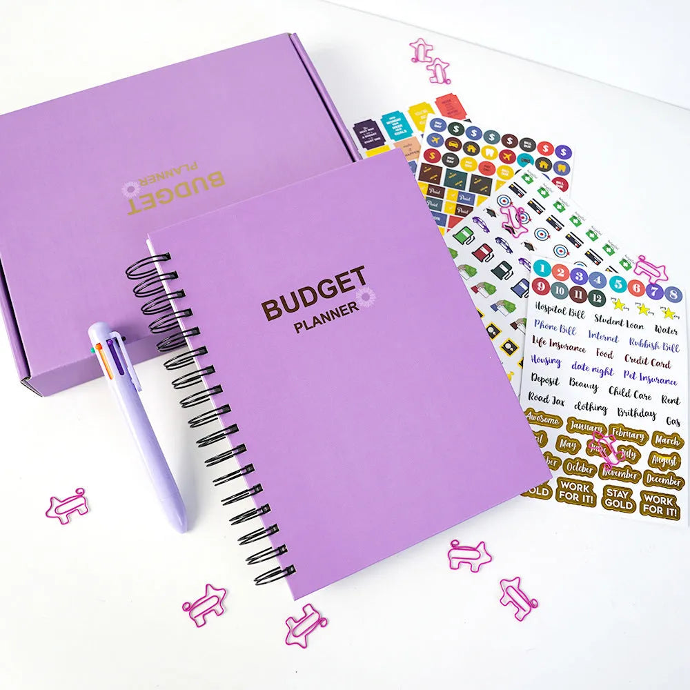 J12 Purple coil-bound financial planning notebook with Daolin paper, pen, stickers, and paper clips for monthly budgeting