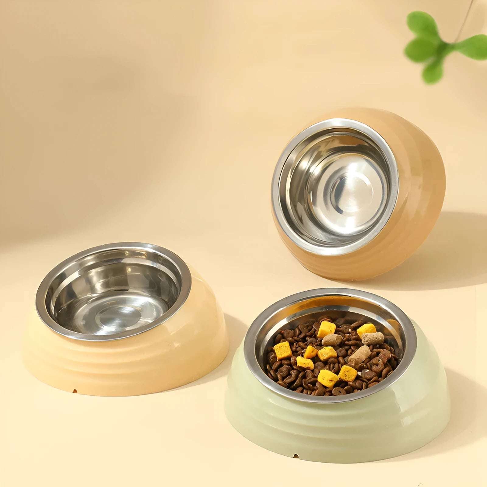 Stainless steel cat bowl with plastic base in beige, brown, and light green colour options