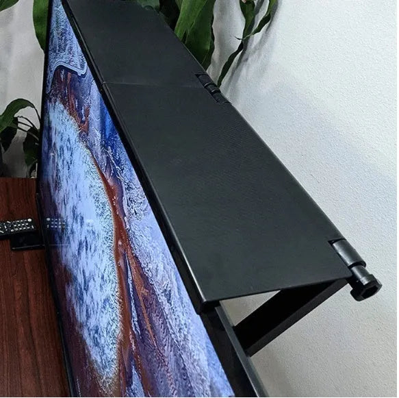 Black adjustable 13-inch screen top shelf mounted above a monitor, holding a streaming device and remote.
