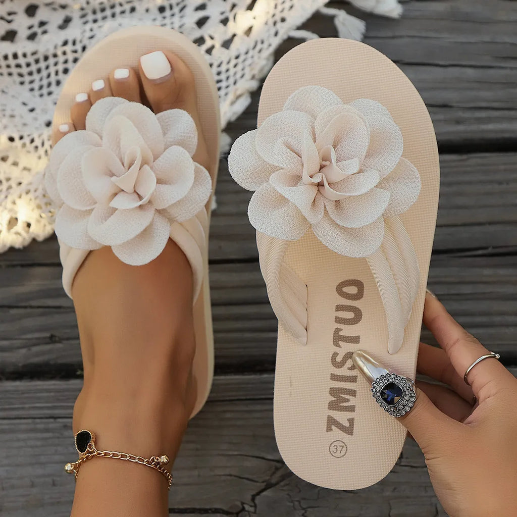 Women's plus size floral flip flop slippers in solid green colour, showing round toe shape