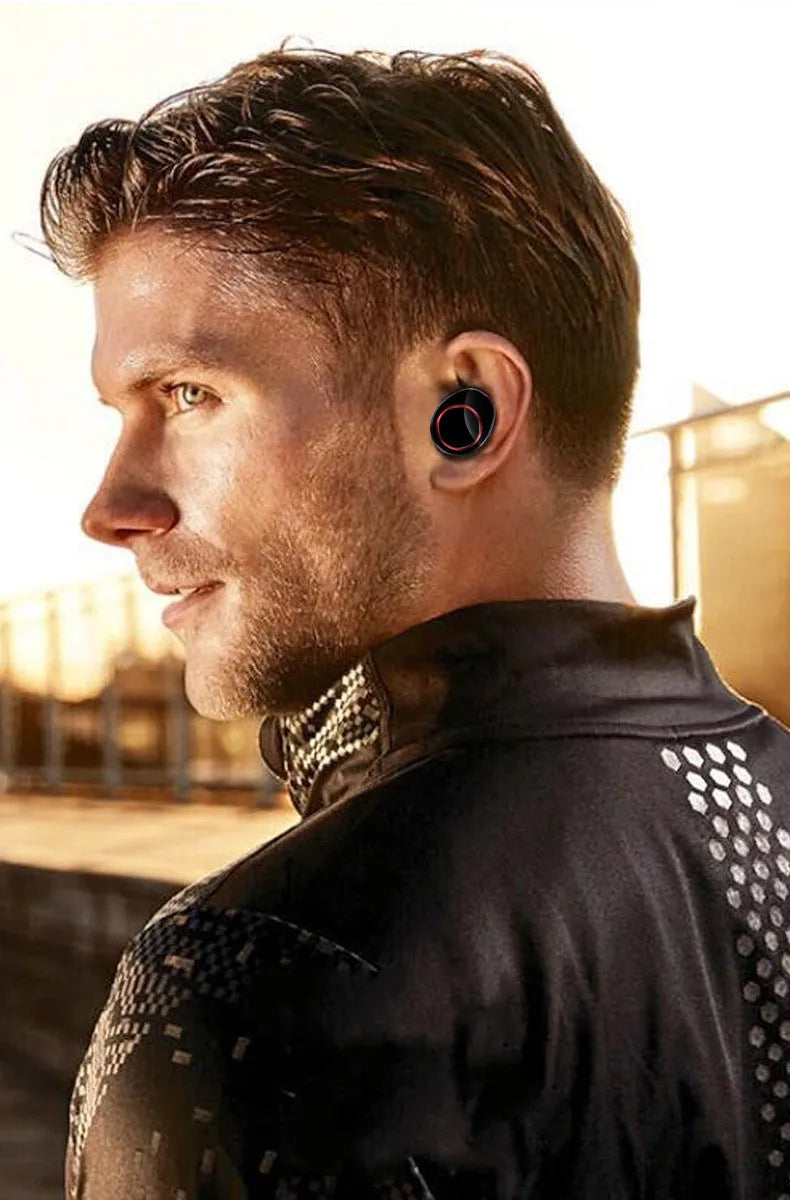 Black X11 wireless Bluetooth earbuds and charging case with silicone ear tips on a white background.