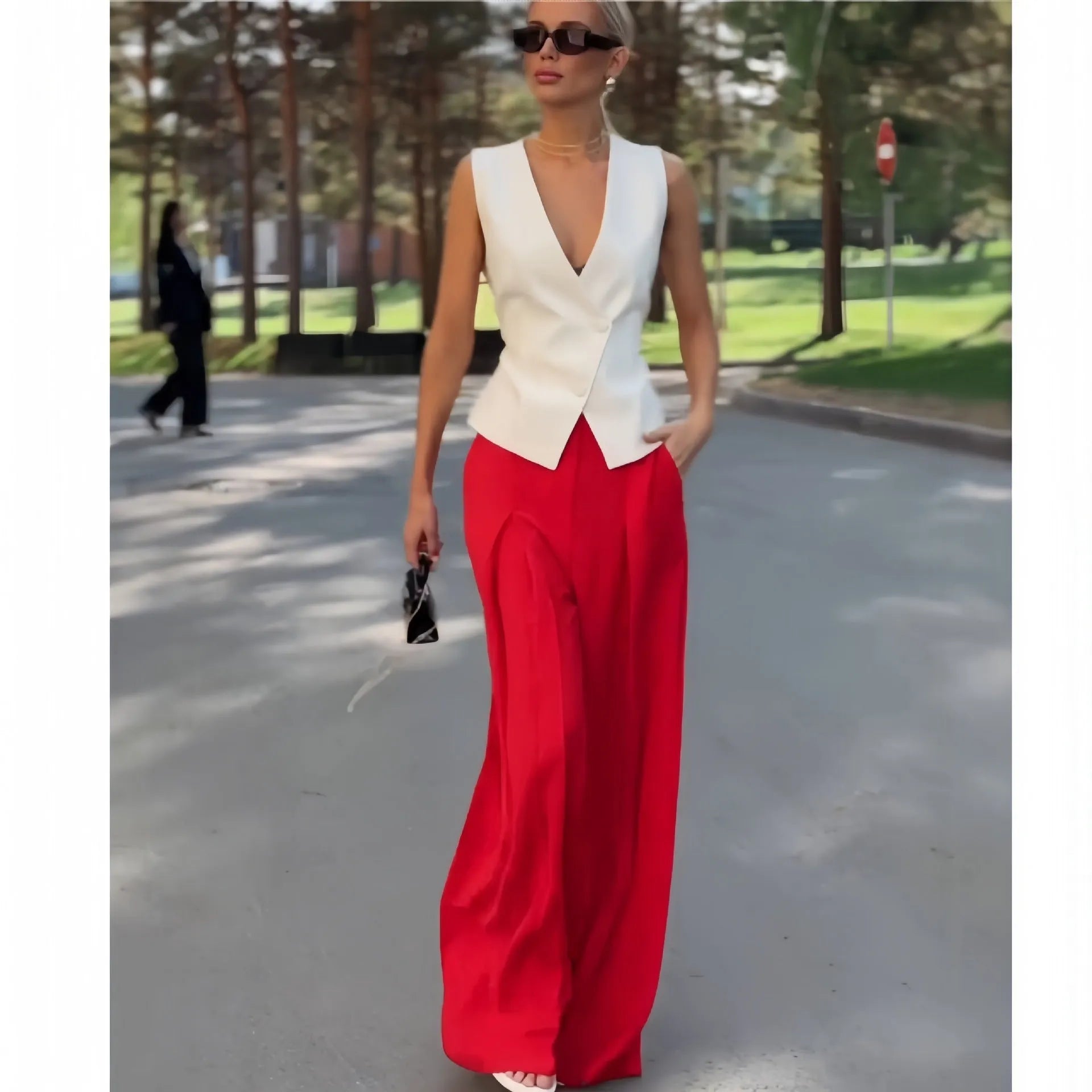Women's beige deep V-neck sleeveless top with matching high-waist wide-leg trousers two-piece set