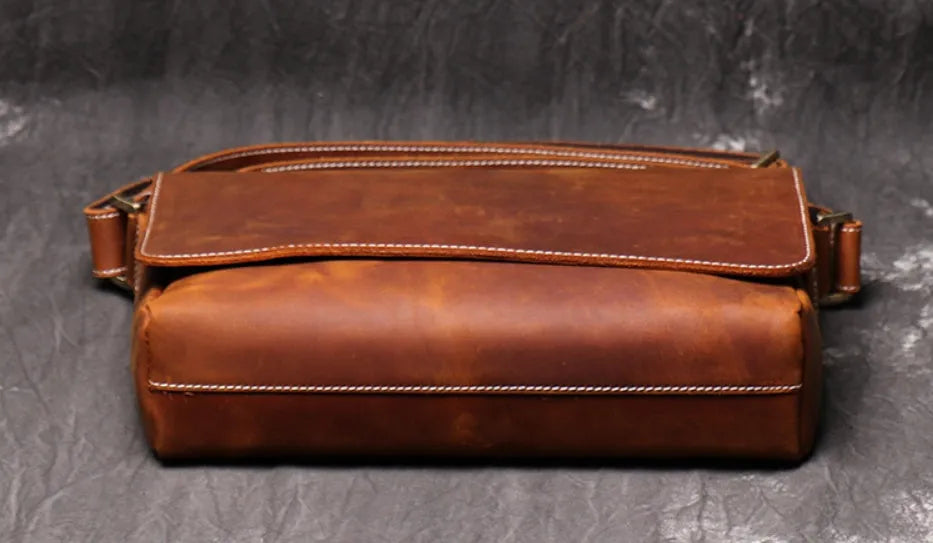 Men's vintage brown leather messenger bag with flap cover and adjustable shoulder strap