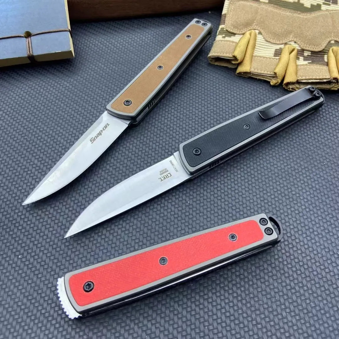 CRKT 7190 folding fruit knife showing blade and handle with colour options of black, brown, and red