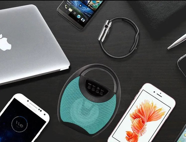Portable Bluetooth speaker in black, blue, or pink with USB port and playback controls