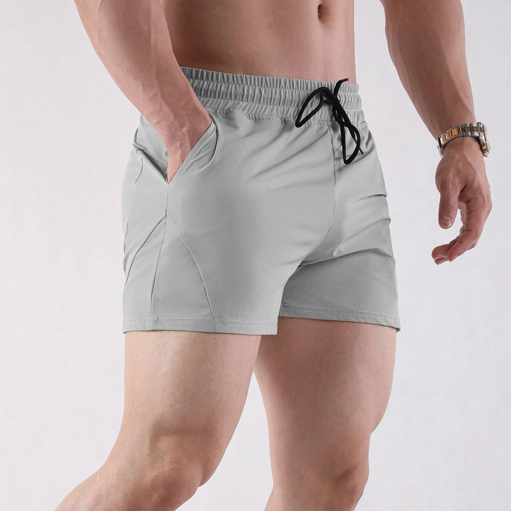 Men's thin gray polyester basketball shorts with elastic waistband for summer sports.
