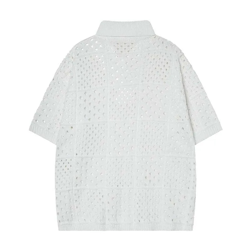 Black and white loose-fit cardigan-style short-sleeved polo shirt for teenagers on a hanger.