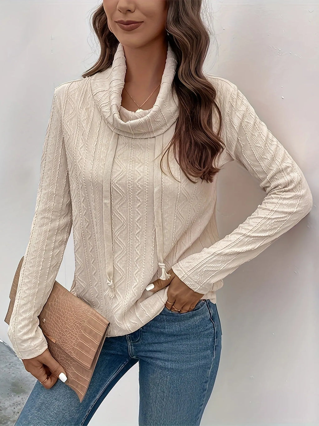 Apricot coloured long sleeve hooded pullover sweater with a drawstring