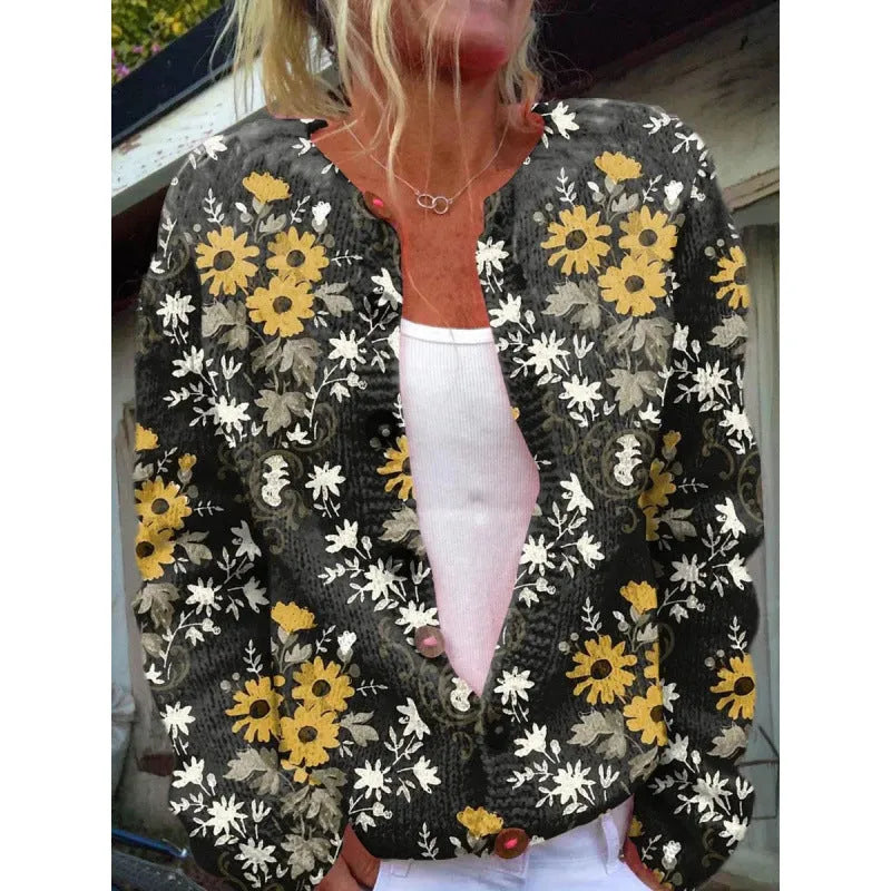 Yellow digital print cardigan knit coat with a raised 3D pattern on a hanger.