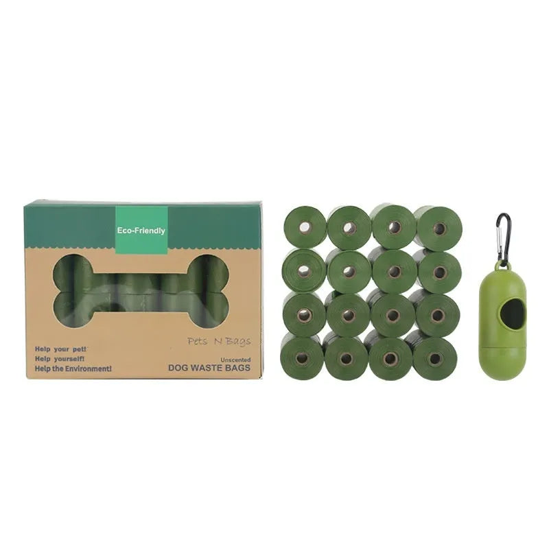 Roll of green EPI degradable dog poop bags next to a white dispenser on a table.