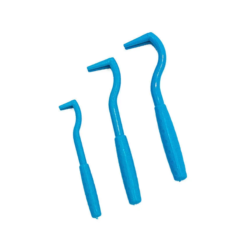 Set of three blue and green plastic pet tick removal clips on a white background.