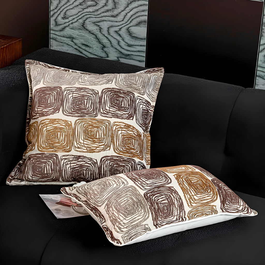 Square pillow cover with abstract coil pattern in cream and coffee colours