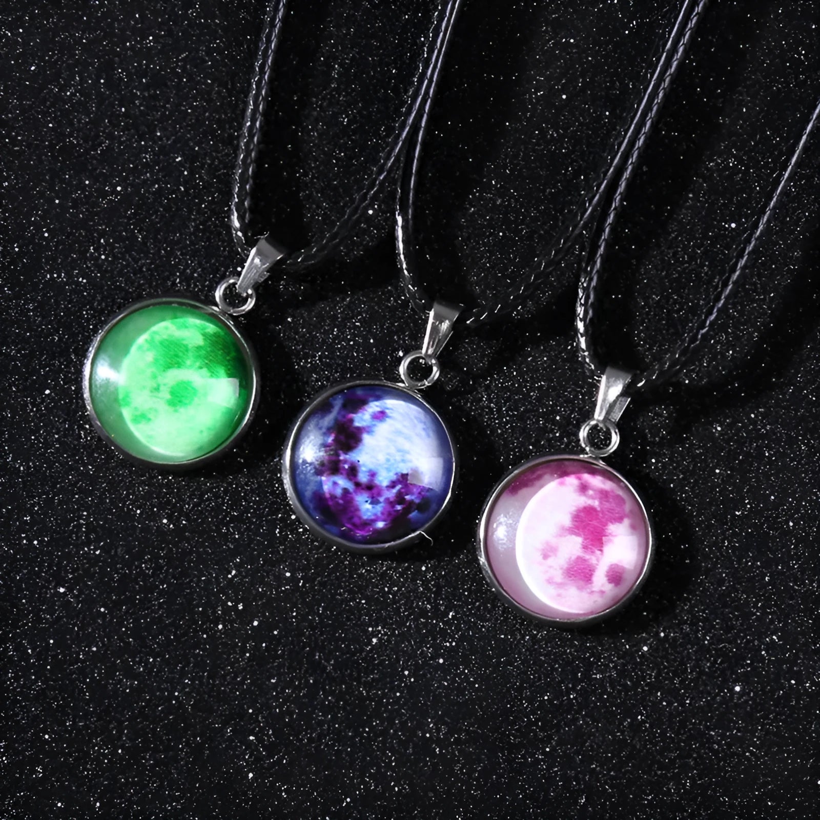 Luminous moon and constellation pendant necklace on a chain with an extension, shown in one of ten possible colours.