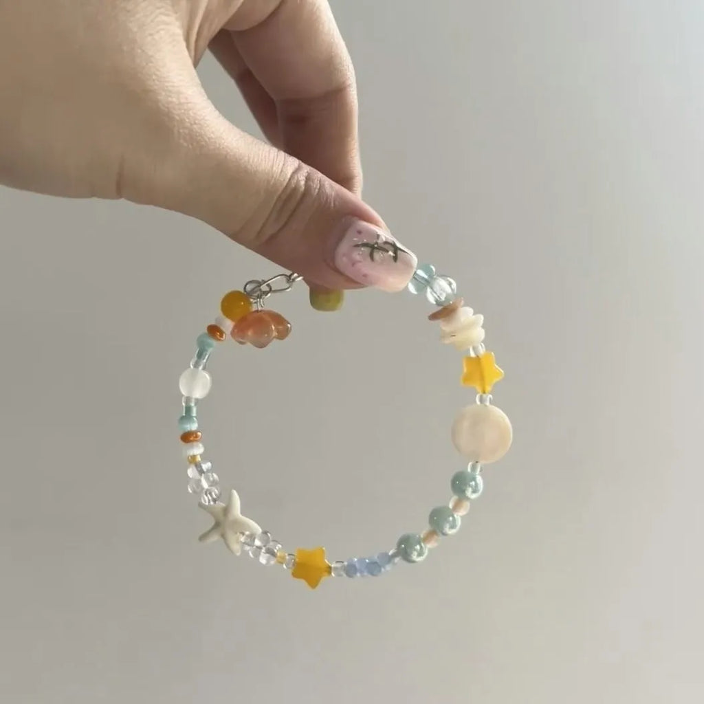 Orange seaside summer bracelet with round diamond elements and mixed alloy material construction