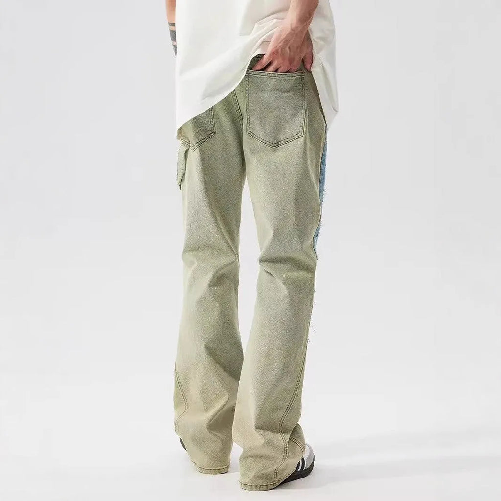 Retro dual-colour patchwork jeans with splash-ink damaged design in yellow and blue