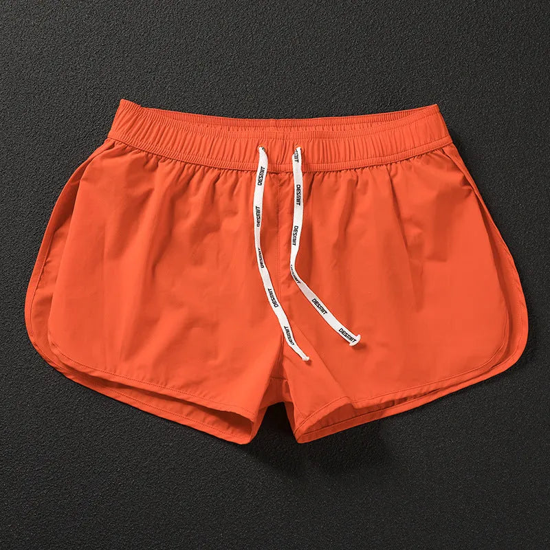 Men's loose-fitting orange polyester beach trousers for surfing and casual summer wear