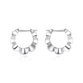 A pair of sterling silver retro geometric V-shaped earrings with a round element and electroplated finish.
