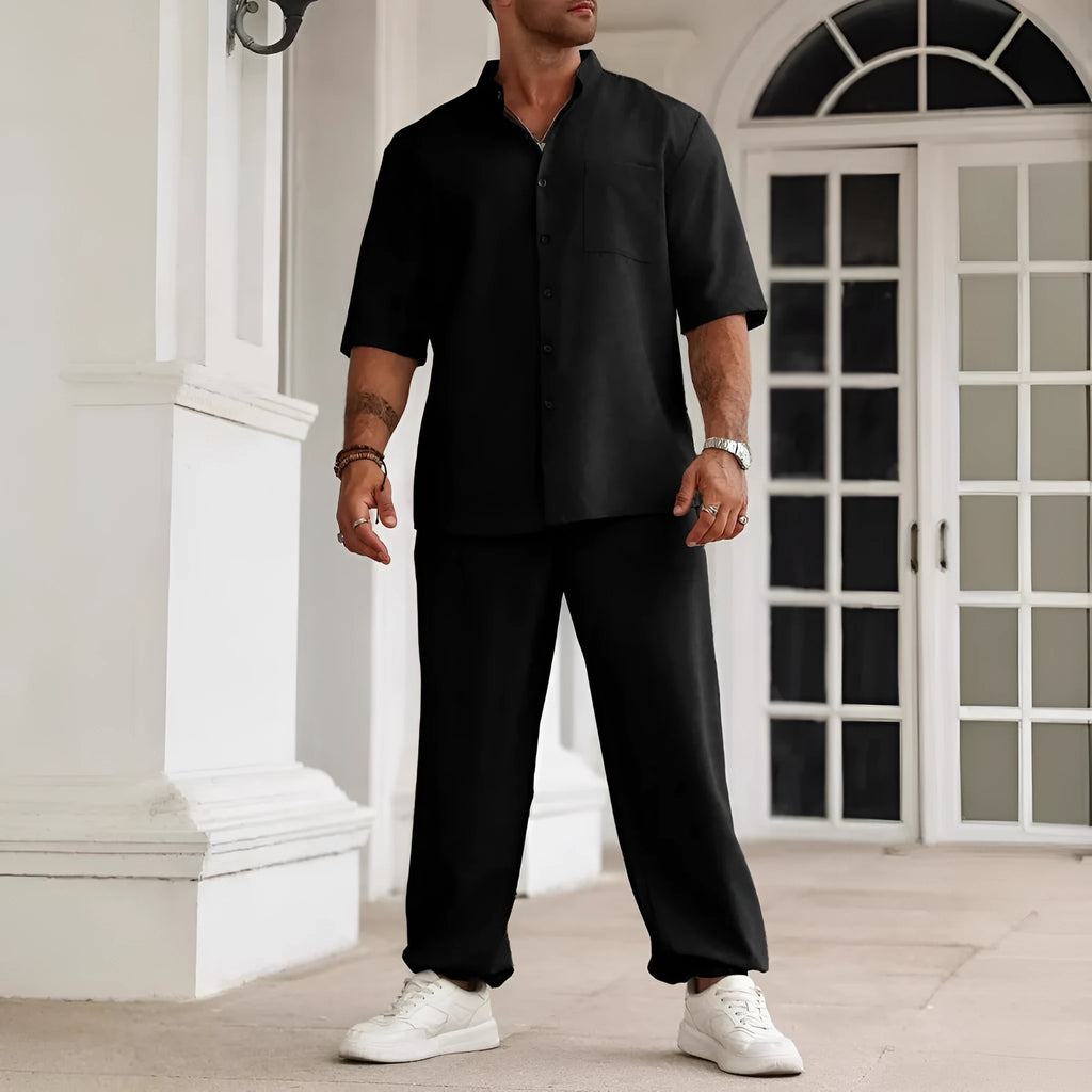 Men's apricot coloured cotton linen short sleeve shirt and matching casual trousers laid flat.