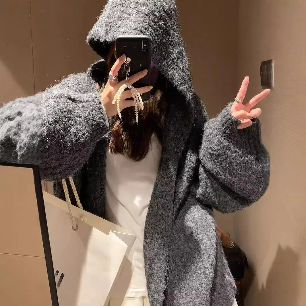 Women's thick grey retro Maillard style hooded cardigan sweater on a hanger