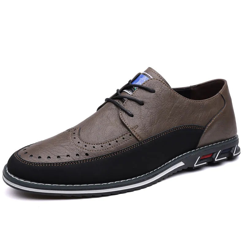 Men's black leather-toe casual shoes with a fabric upper and rubber sole on a plain background.