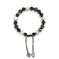 Black agate map stone diamond-shaped volcanic rock bracelet on a wrist, showing New Chinese style.