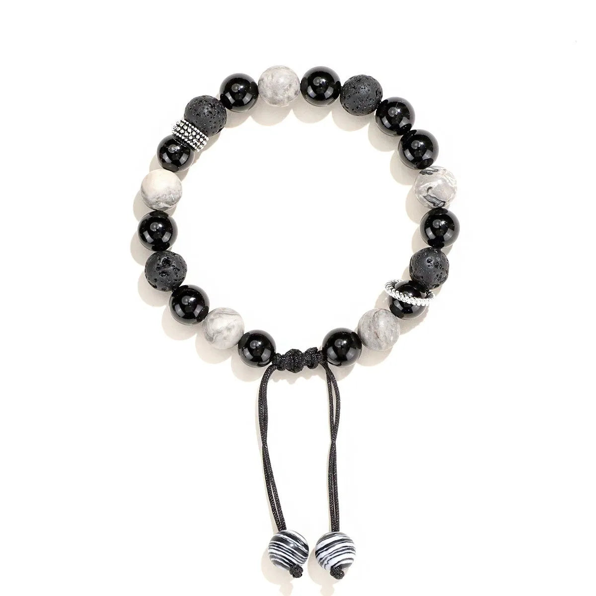 Black agate map stone diamond-shaped volcanic rock bracelet on a wrist, showing New Chinese style.