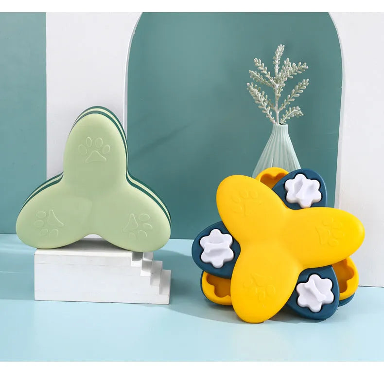 Green and yellow interactive dog puzzle toy with rotatable compartments and bone-shaped covers