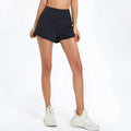 Nylon women's high-waist quick-drying fitness shorts in black, shown flat.