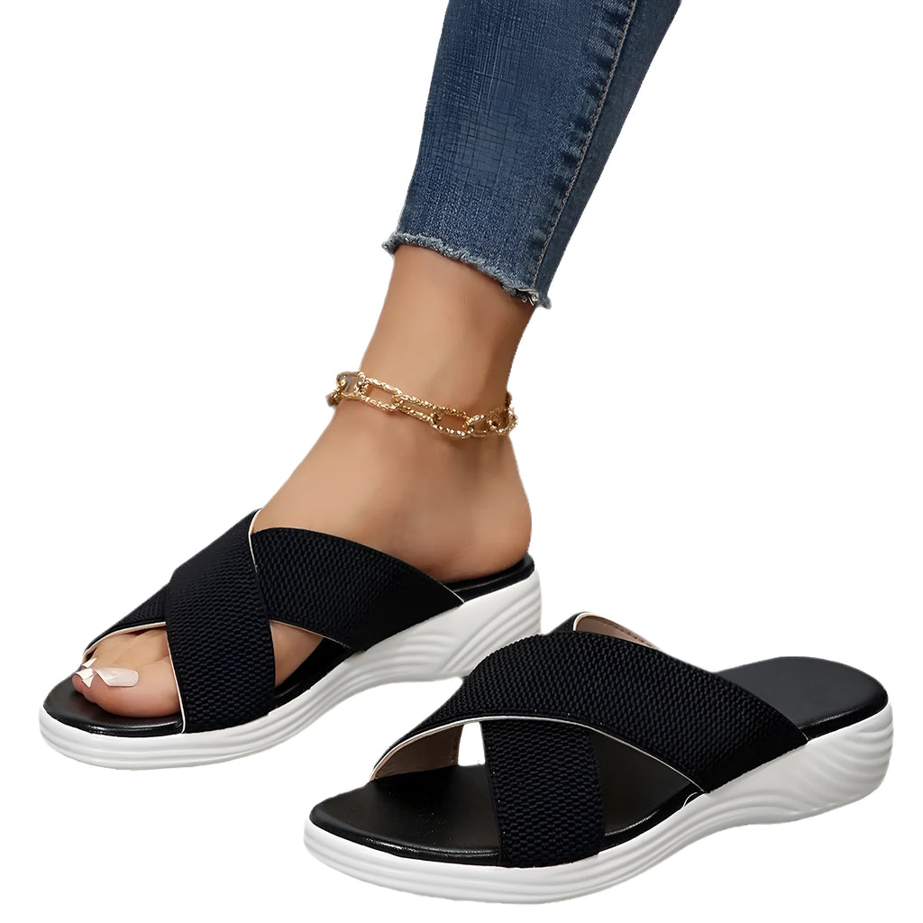Black wedge slippers with peep-toe opening and thick rubber sole