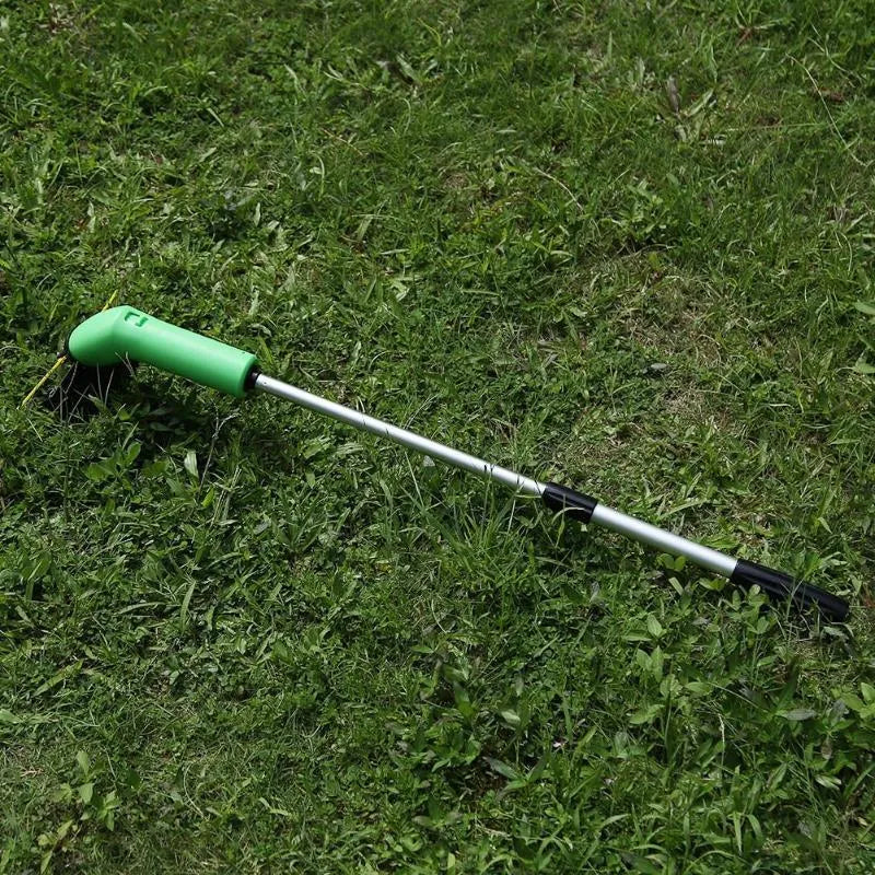 Cordless Zip Trim lawn trimmer with extension pole and protective shield on garden grass