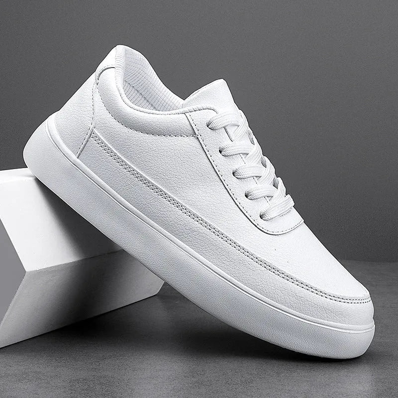 Women's white leather lace-up casual flat shoes on a plain background