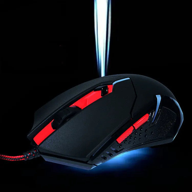 Black and red ergonomic USB wired gaming mouse with six buttons on a desk