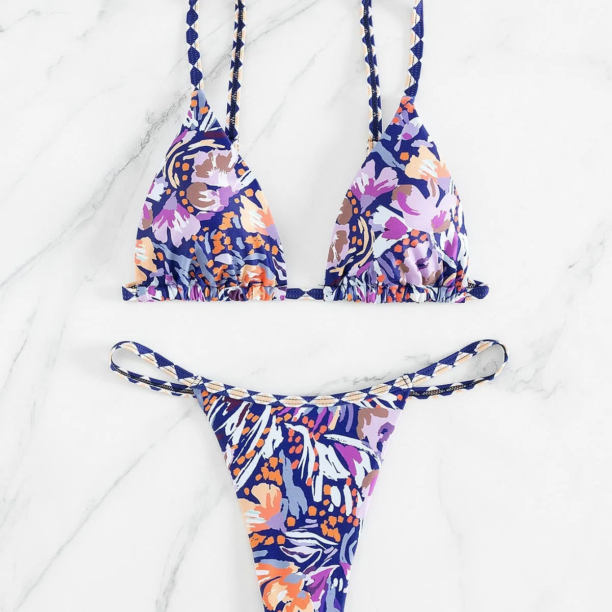 Women's floral print polyester swimsuit briefs on a white background.