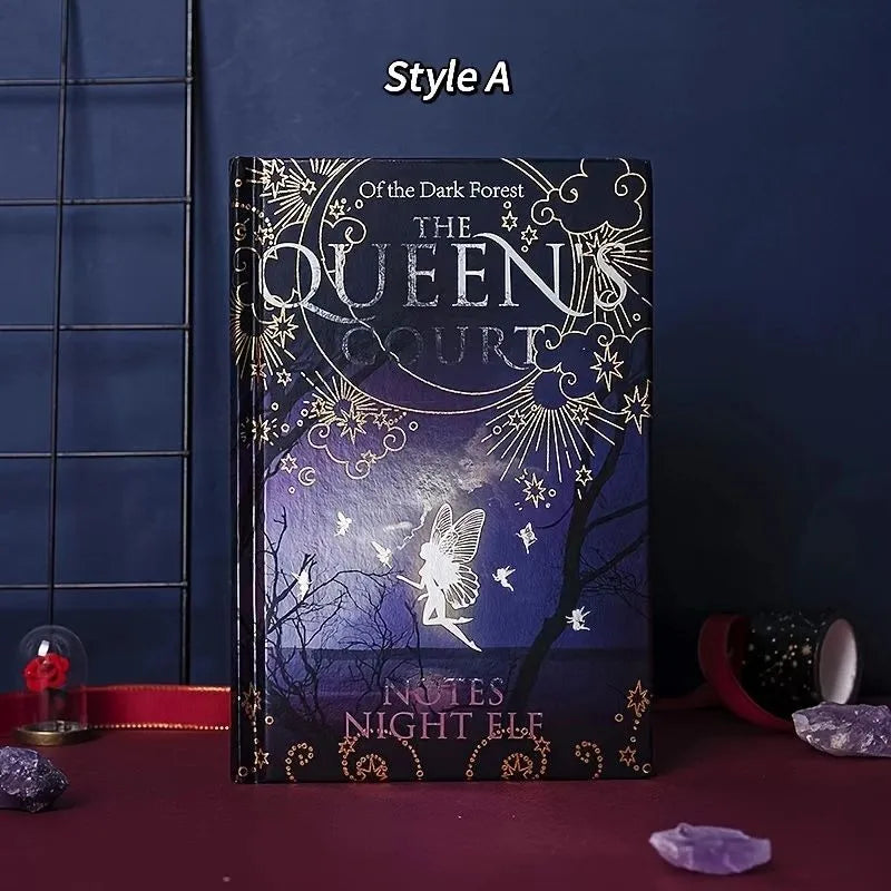 Blue luminous hardcover A5 notebook lying open on a desk, showing full-colour illustrated pages.